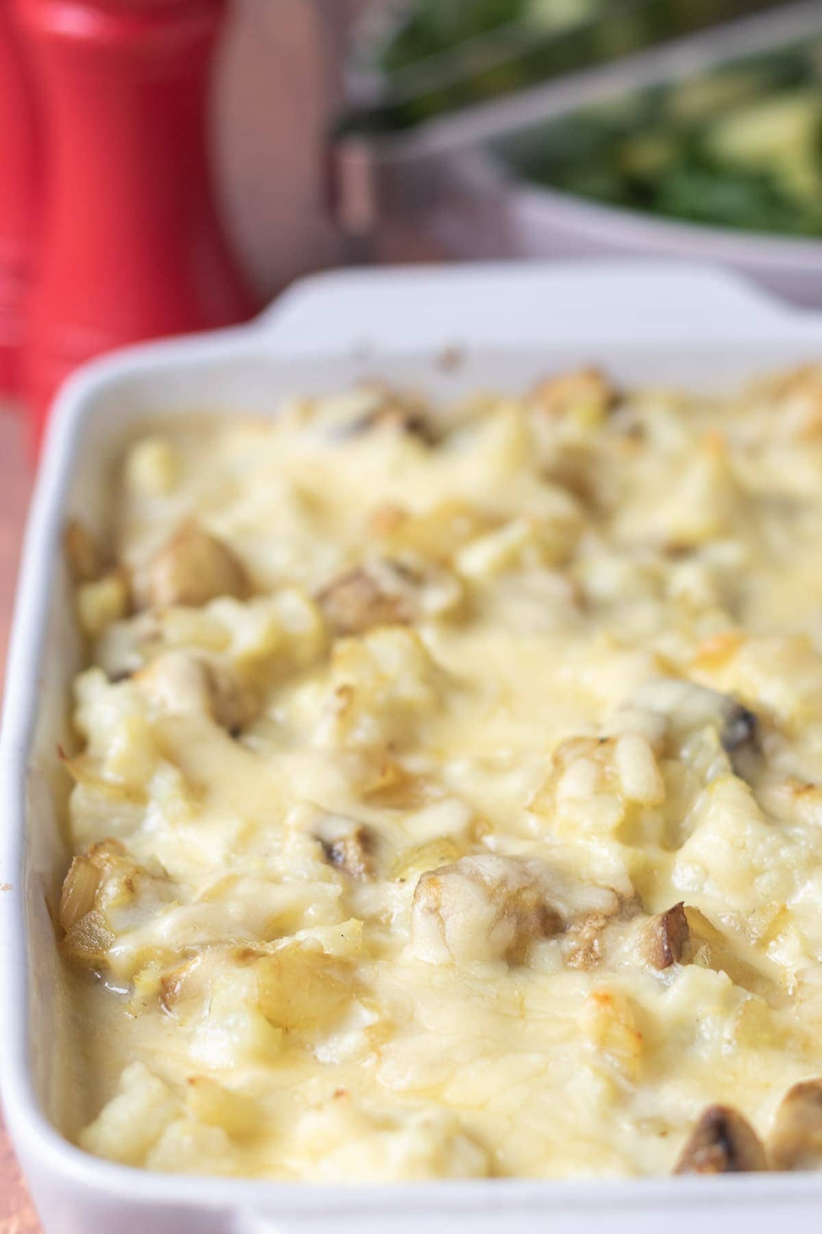 Close up view of cooked cheesy cauliflower mushroom bake ready to serve.