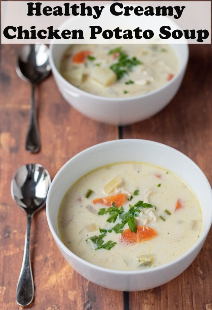 Two bowls of healthy creamy chicken potato soup with spoons beside. Pin title text overlay at top.
