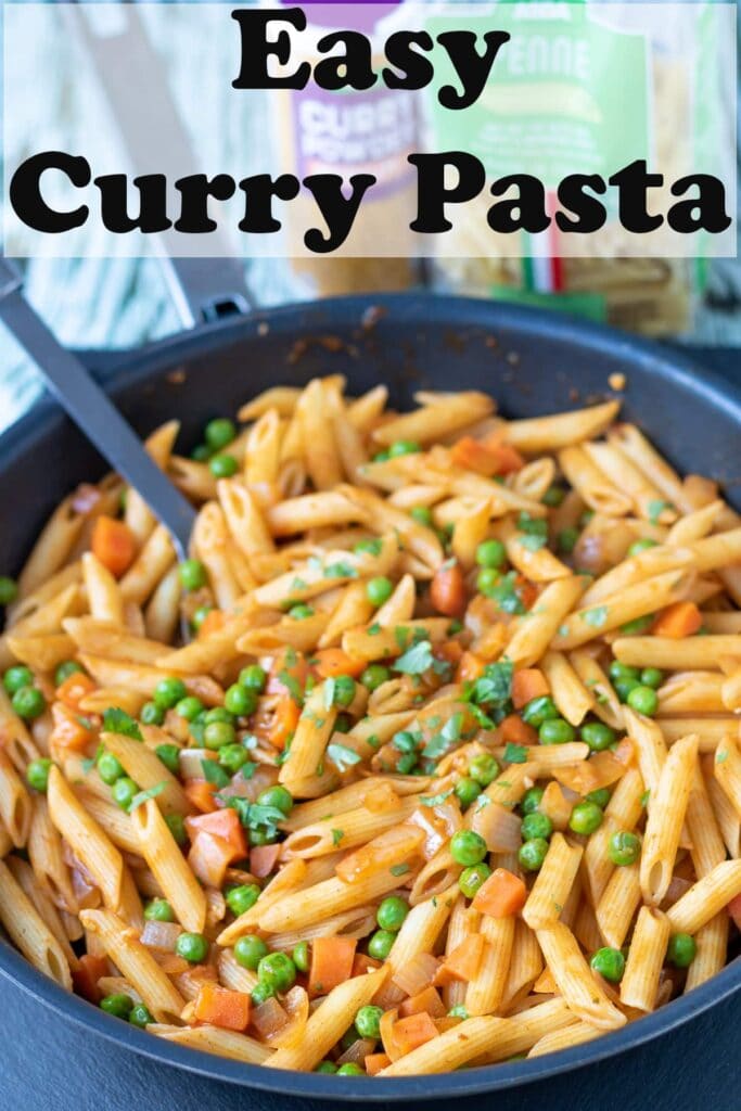 Easy curry pasta cooked in a pan and ready to serve. Pin title text overlay at top.