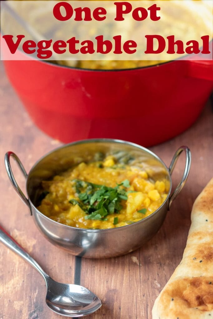 A balti dish of one pot vegetable dahl garnished with chopped coriander and a spoon and naan bread in front. Rest of the dish in a casserole pot at rear. Pin title text overlay at top.