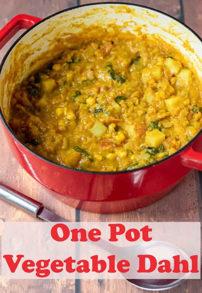 One pot vegetable dahl curry in a large casserole pot. Pin title text overlay below.