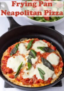 Frying pan neapolitan pizza in a skillet. Pin title text overlay at top.