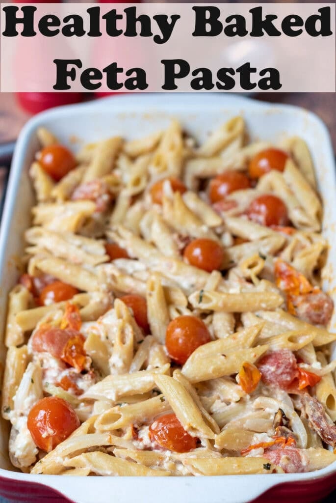 Healthy baked feta pasta cooked and removed from the over in a rectangle pasta dish. Pin title text overlay at top.