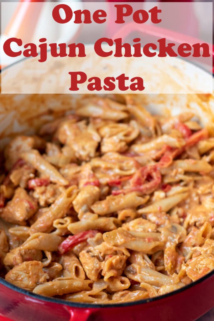One pot cajun chicken pasta in a large casserole pot. Pin title text overlay at top.