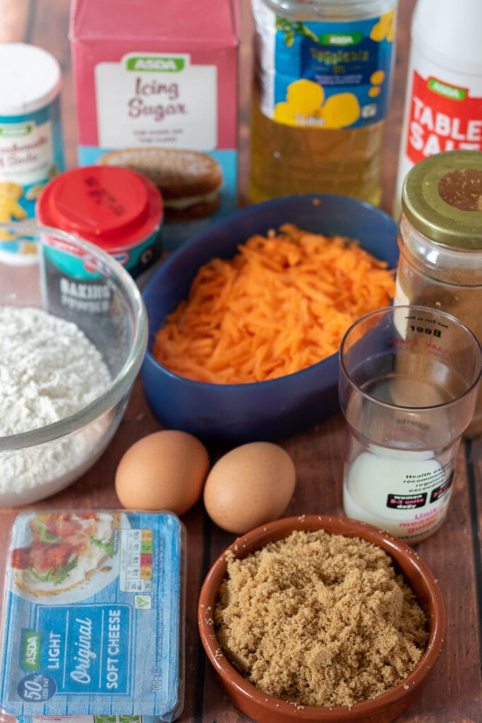 Best carrot cake loaf ingredients laid out on a table.