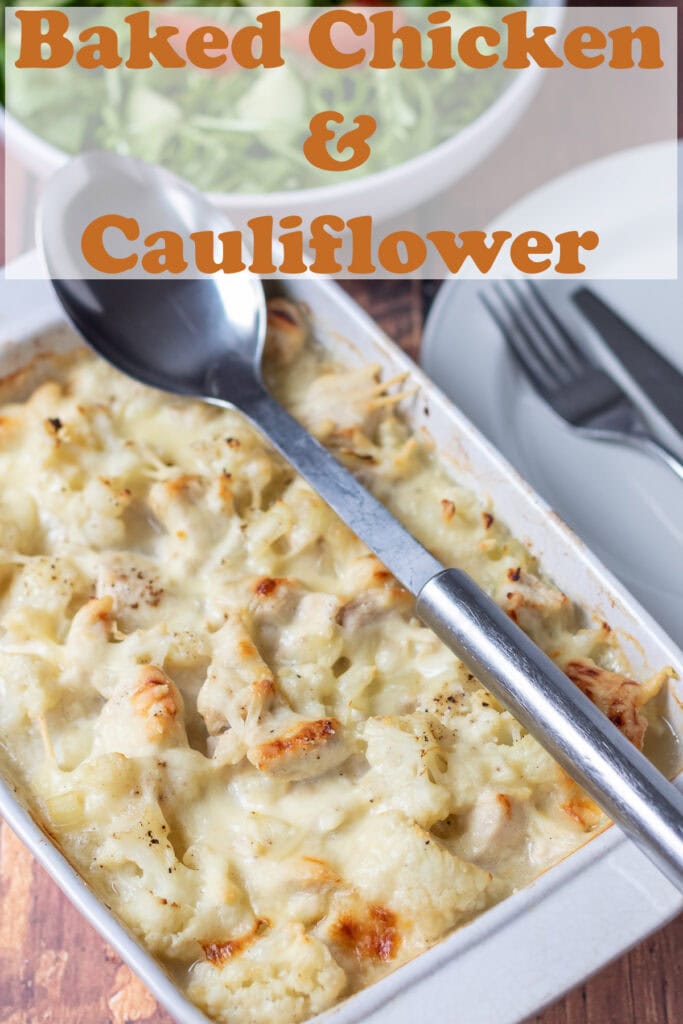 Baked chicken and cauliflower in a casserole dish just removed from the oven with a serving spoon over the top. Pin title text overlay at top.