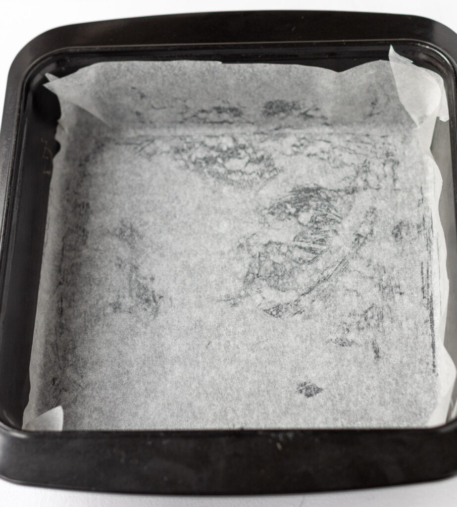 A greased and lined with greaseproof paper baking tin.