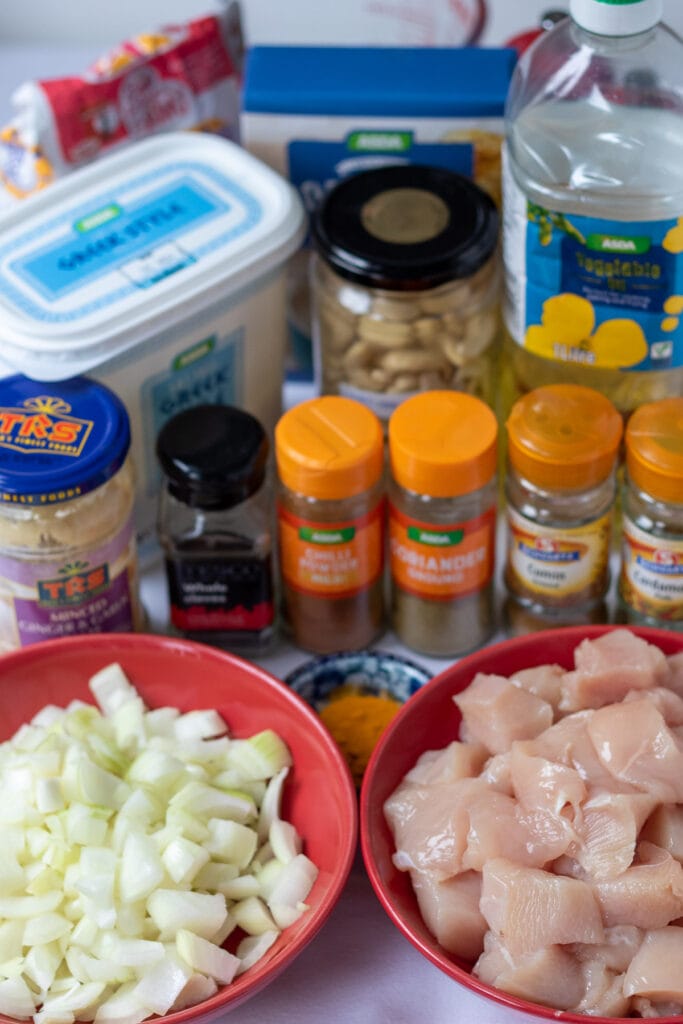 Easy chicken cashew curry ingredients laid out on a table.
