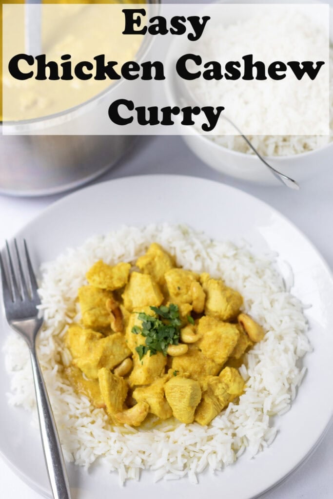 A serving of chicken cashew curry on a white plate garnished with coriander and surrounded by a bed of basmati rice. Pin title text overlay at top.