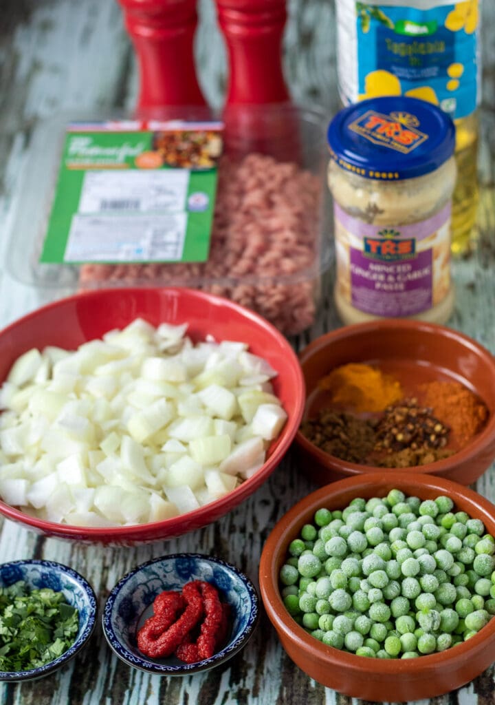 Lamb mince curry ingredients laid out on a table.