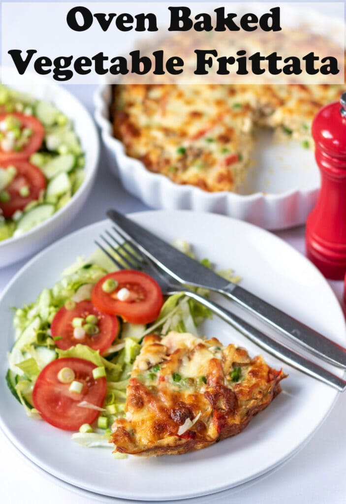 Oven baked vegetable frittata served on a plate with a side salad and knife and fork beside. Pin title text overlay at top.
