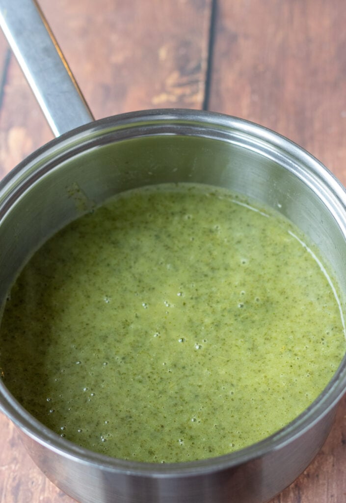 Kale soup blitzed in a blender and returned to the soup pan.