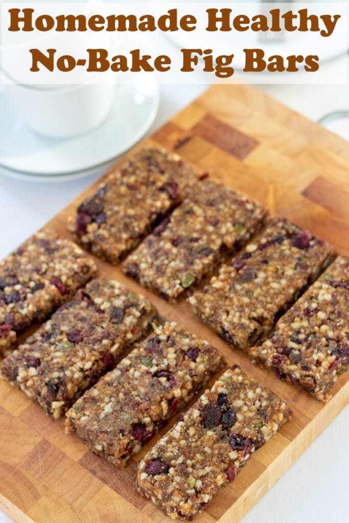 Eight home made healthy fig bars on a chopping board. Pin title text overlay at top.