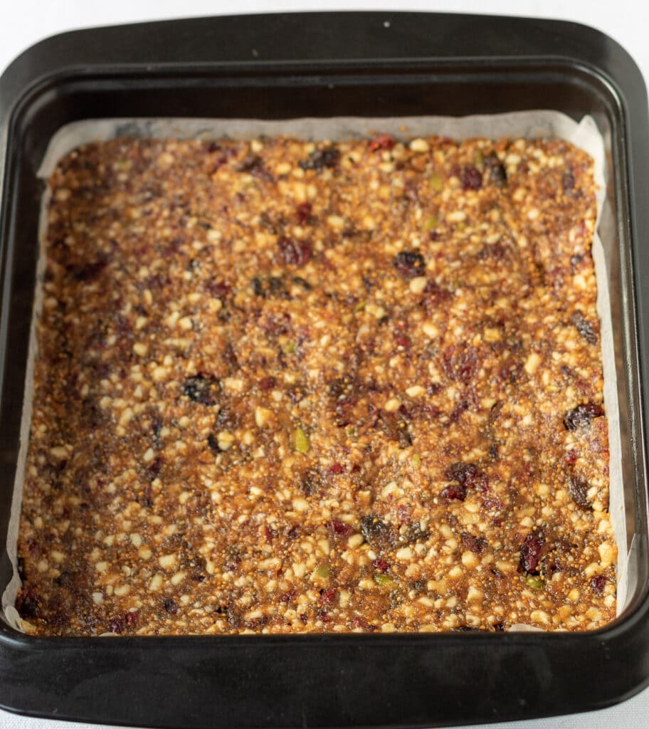 Fig mixture placed into greased square baking tin.