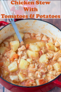 Chicken stew with tomatoes and potatoes. Cooked in a large casserole pot with a ladle in. Pin title text overlay at top.