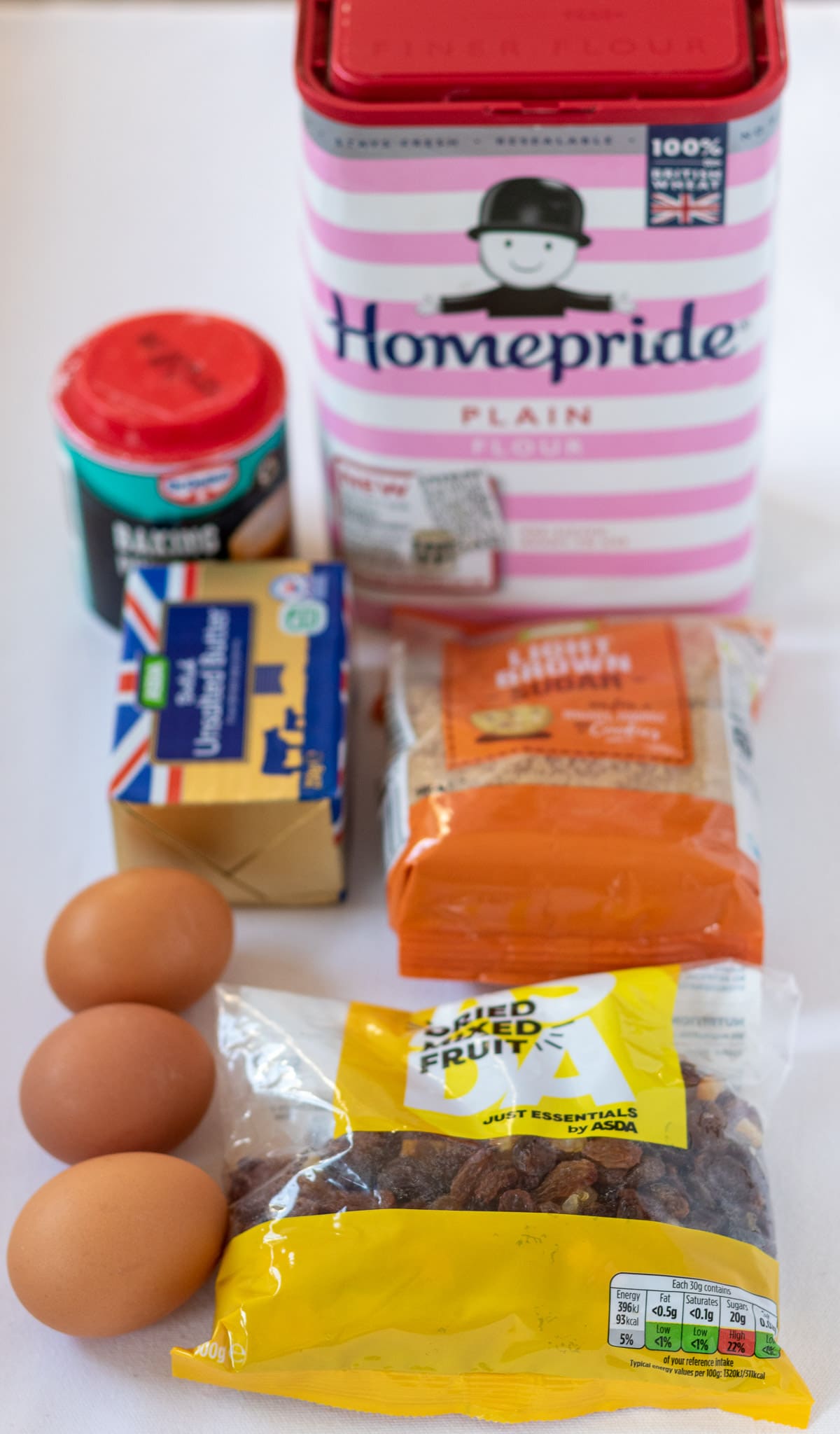 Easy fruit loaf cake ingredients laid out on a table.