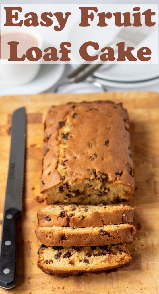 Easy fruit loaf cake on a chopping board with a knife to the left side and slices cut off at the front. Pin title text overlay at top.
