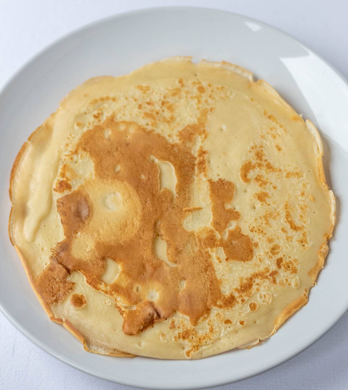Savoury pancake on a plate.
