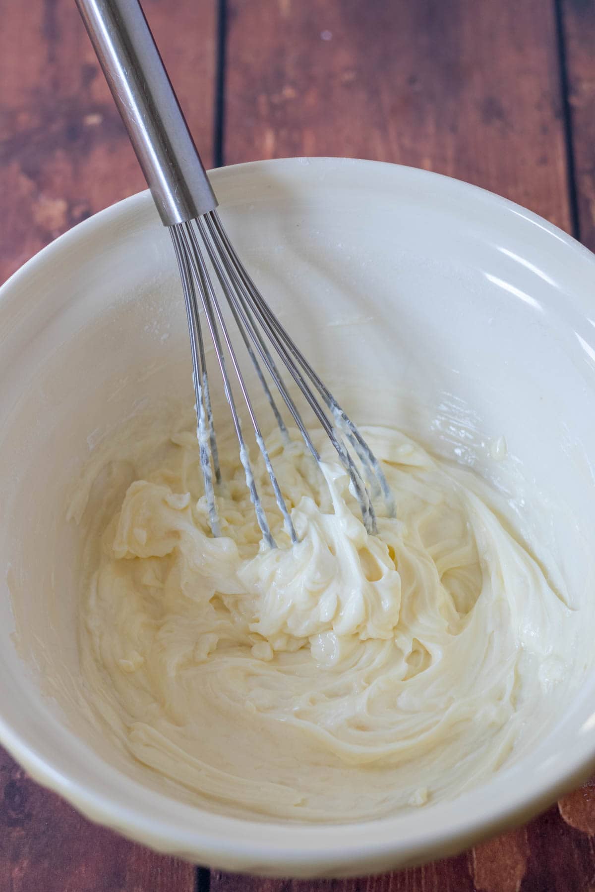 Cream cheese, icing sugar and vanilla extract whisked together in a large bowl.