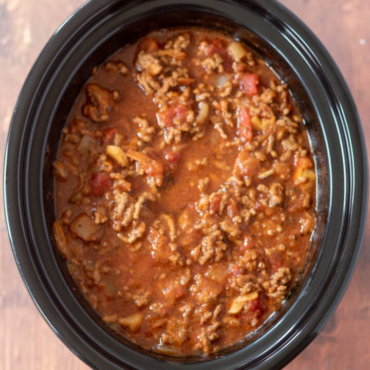 Overhead view of slow cooker spaghetti bolognese in slow cooker.