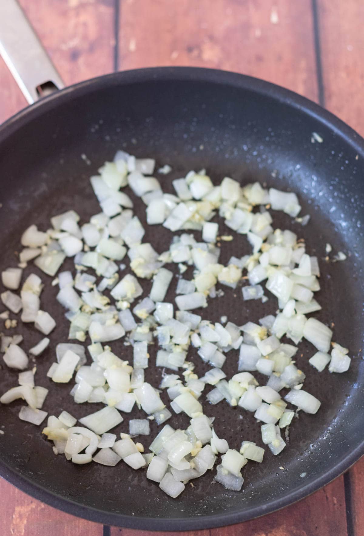 Sautéd onion and garlic in a large frying pan.
