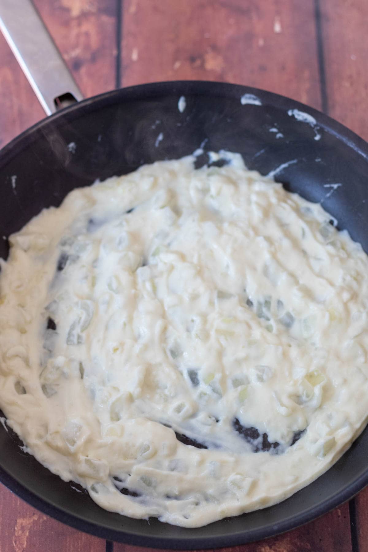 Crème fraiche and lemon juice stirred into the pan with the sauted onion and garlic.