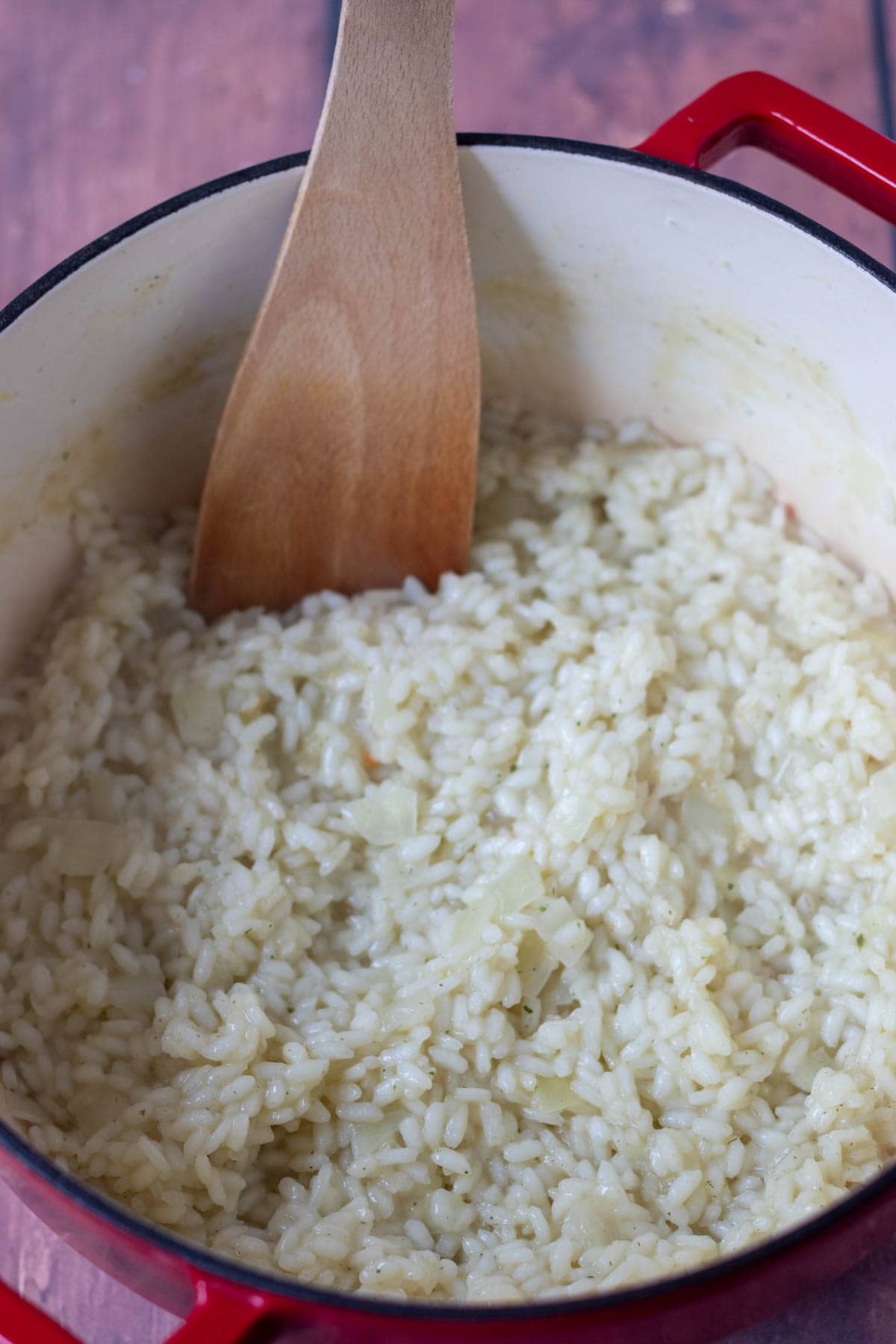 Aborio rice added to sauted onion along with stock and cooked until tender.