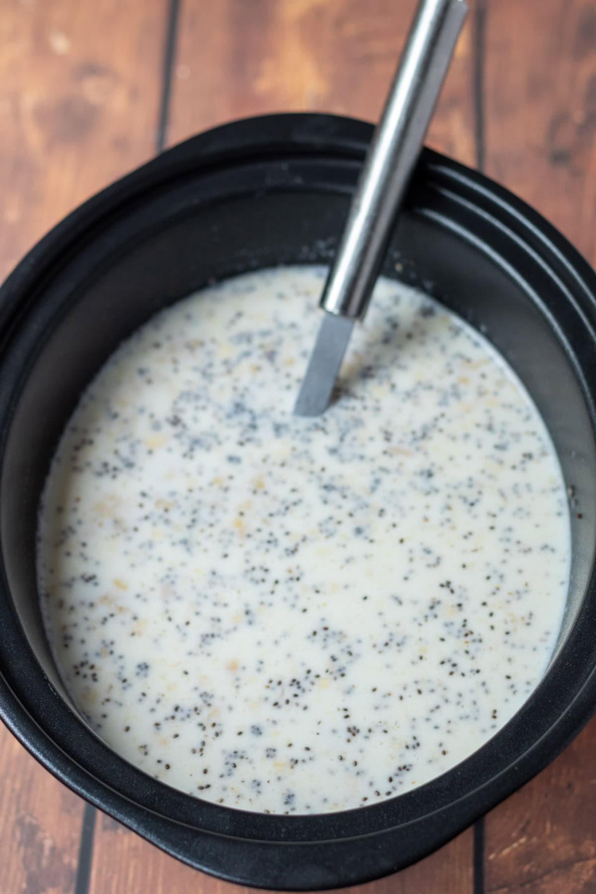 Oats, milk, mashed bananas, chia seeds, and vanilla essence added to slow cooker.