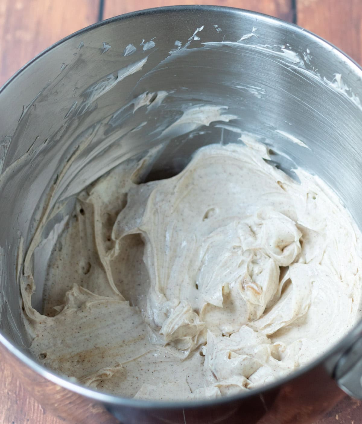 Cream cheese, icing sugar, vanilla extract and spices all whisked together in a large mixing bowl.