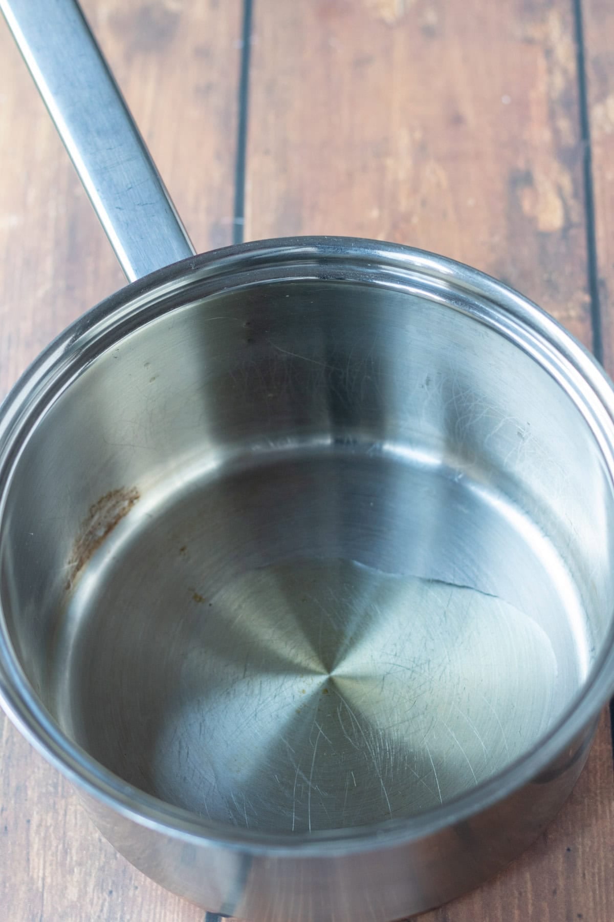 A large saucepan with olive oil in it.