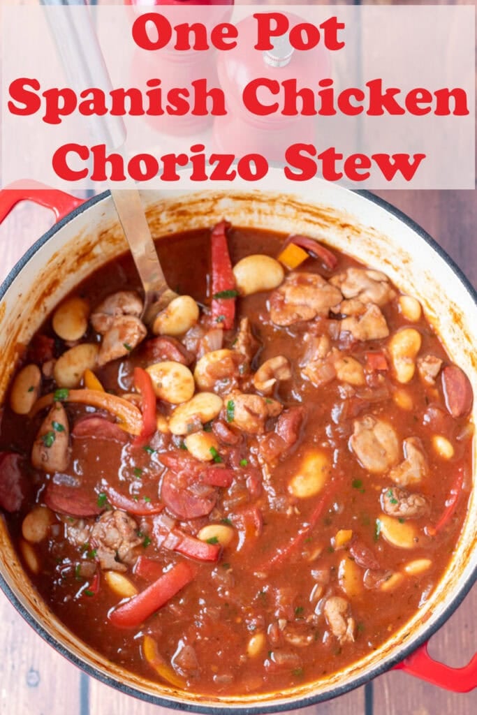 Overhead view of one pot Spanish chicken chorizo stew in a large casserole pot. Pin title text overlay below.