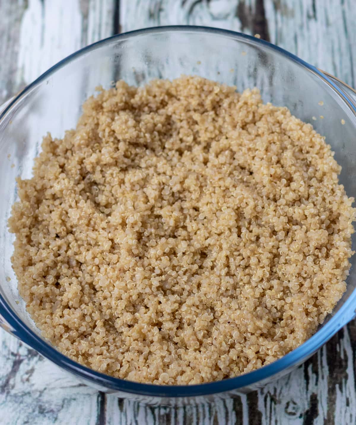 Cooled quinoa in a large mixing bowl.
