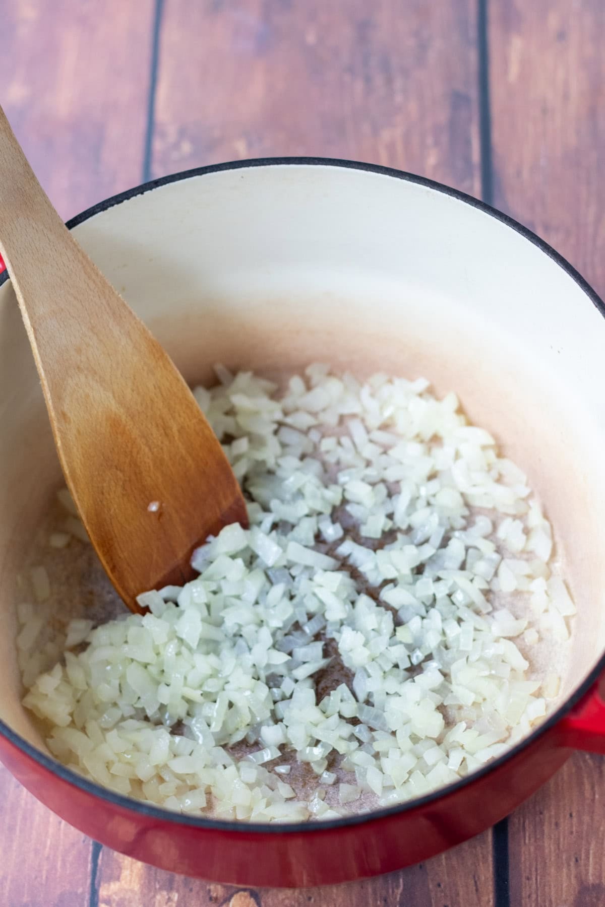 Diced onion cooked in a large casserole pot.