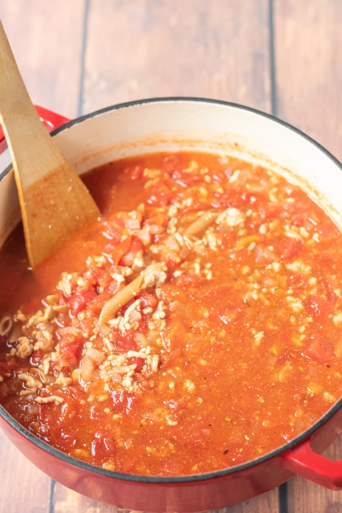 Wholewheat penne pasta added to the large casserole pot and brought to a boil.