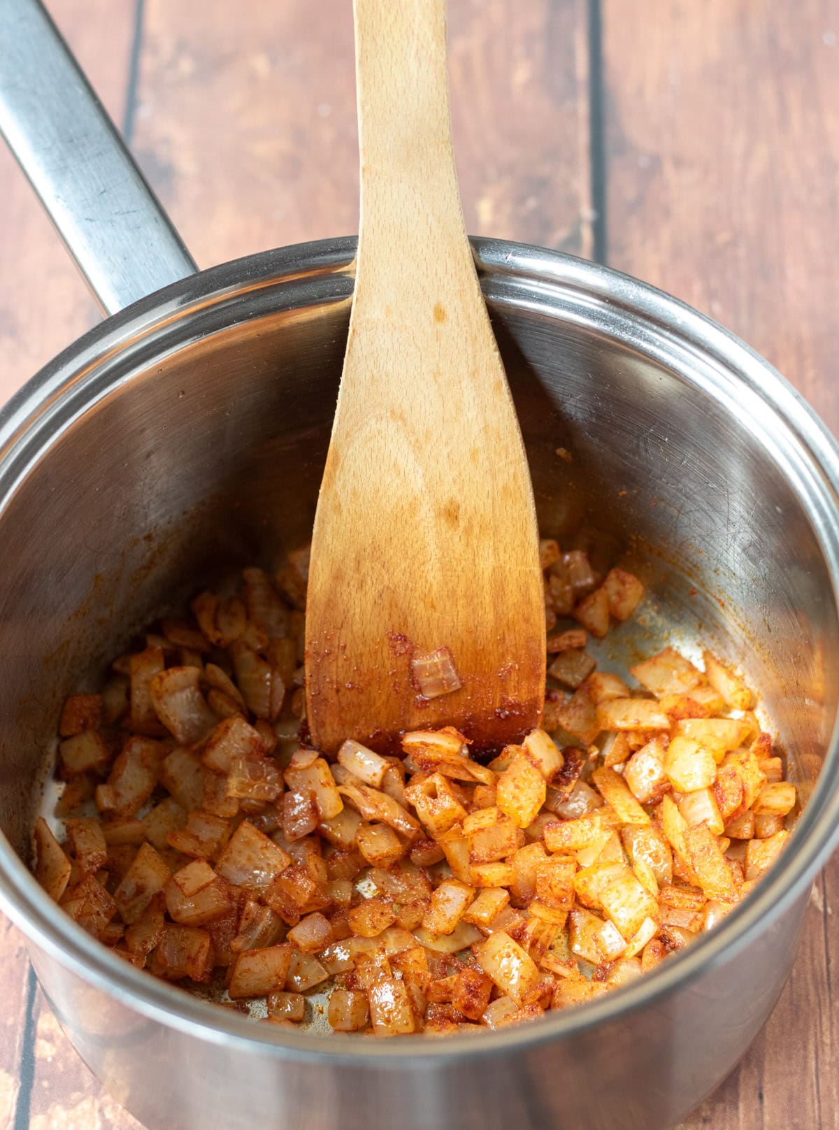 Smoked paprika and ground cumin stirred into the softened onion.