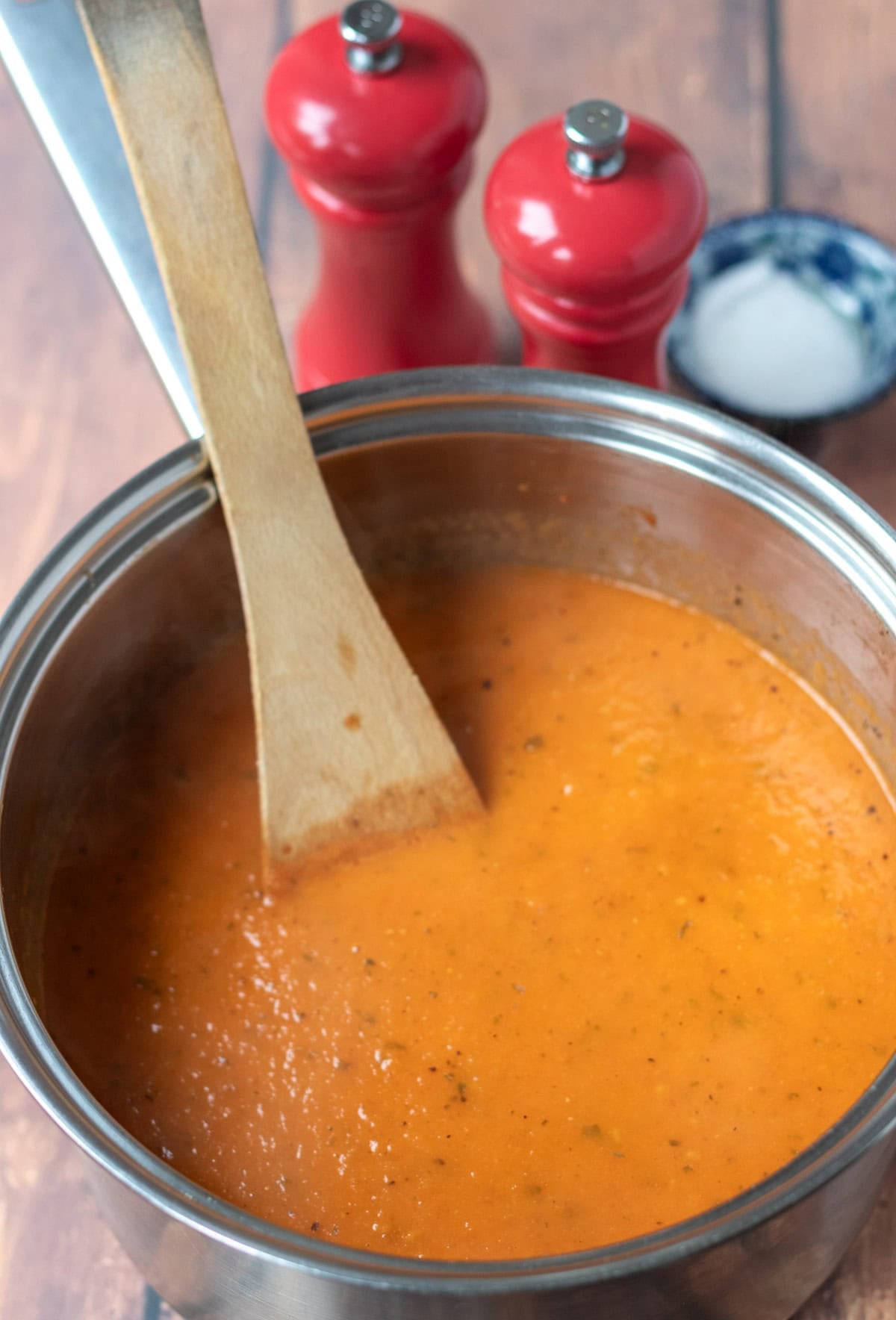 Blended tomato basil soup returned to the large saucepan and seasoned to taste and sugar added if necessary.